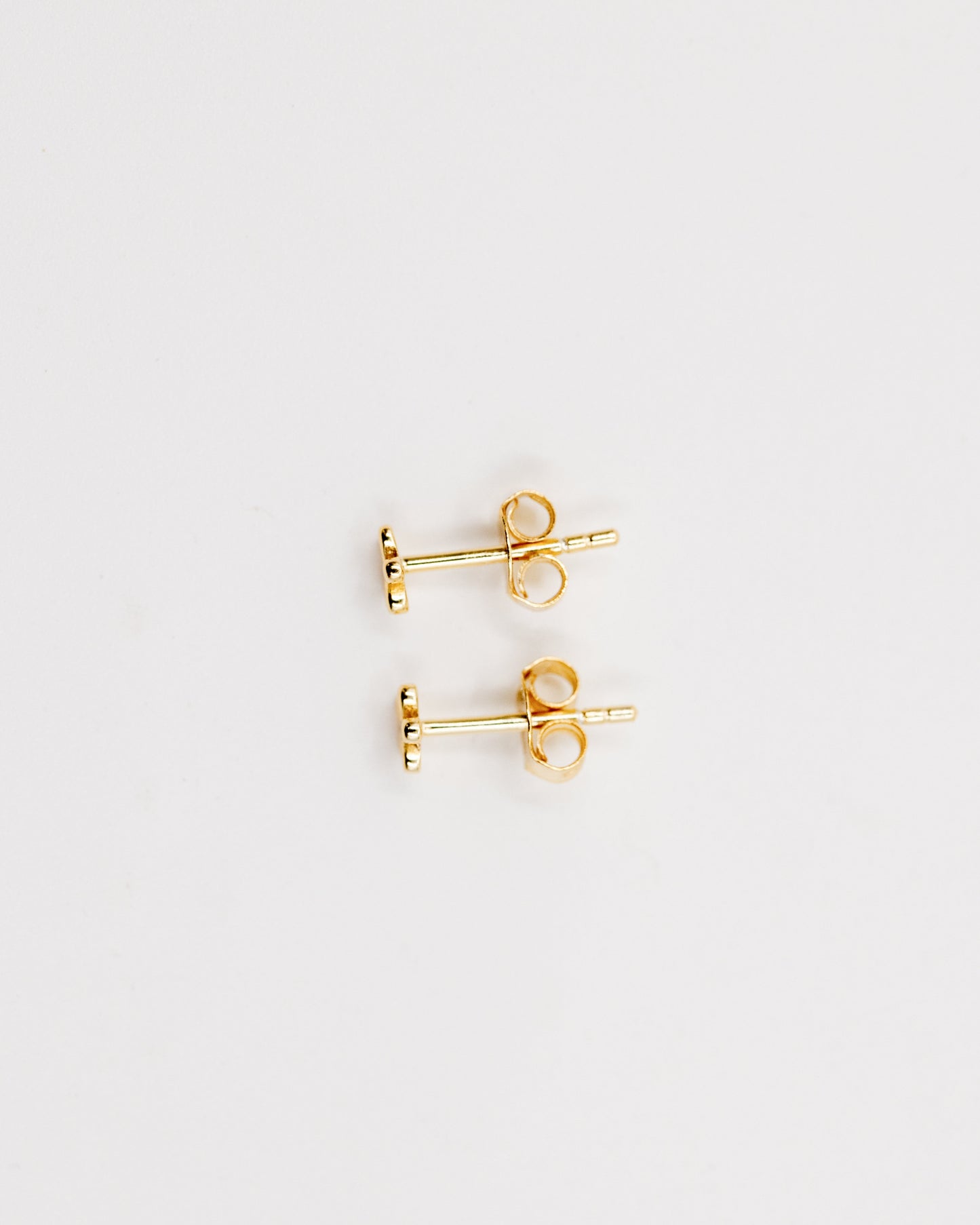 Teeny tiny flower stud earrings gold
