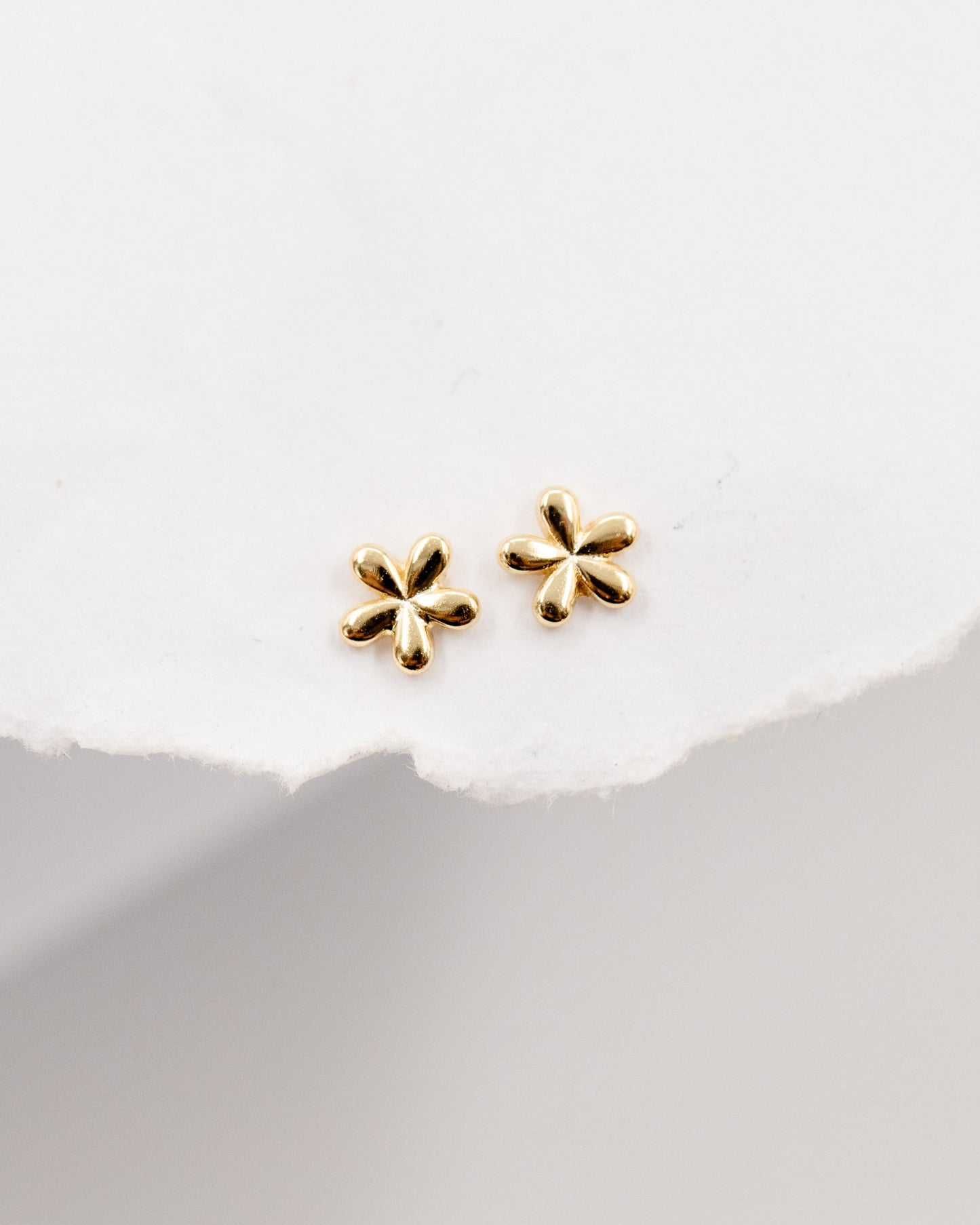 Teeny tiny flower stud earrings gold