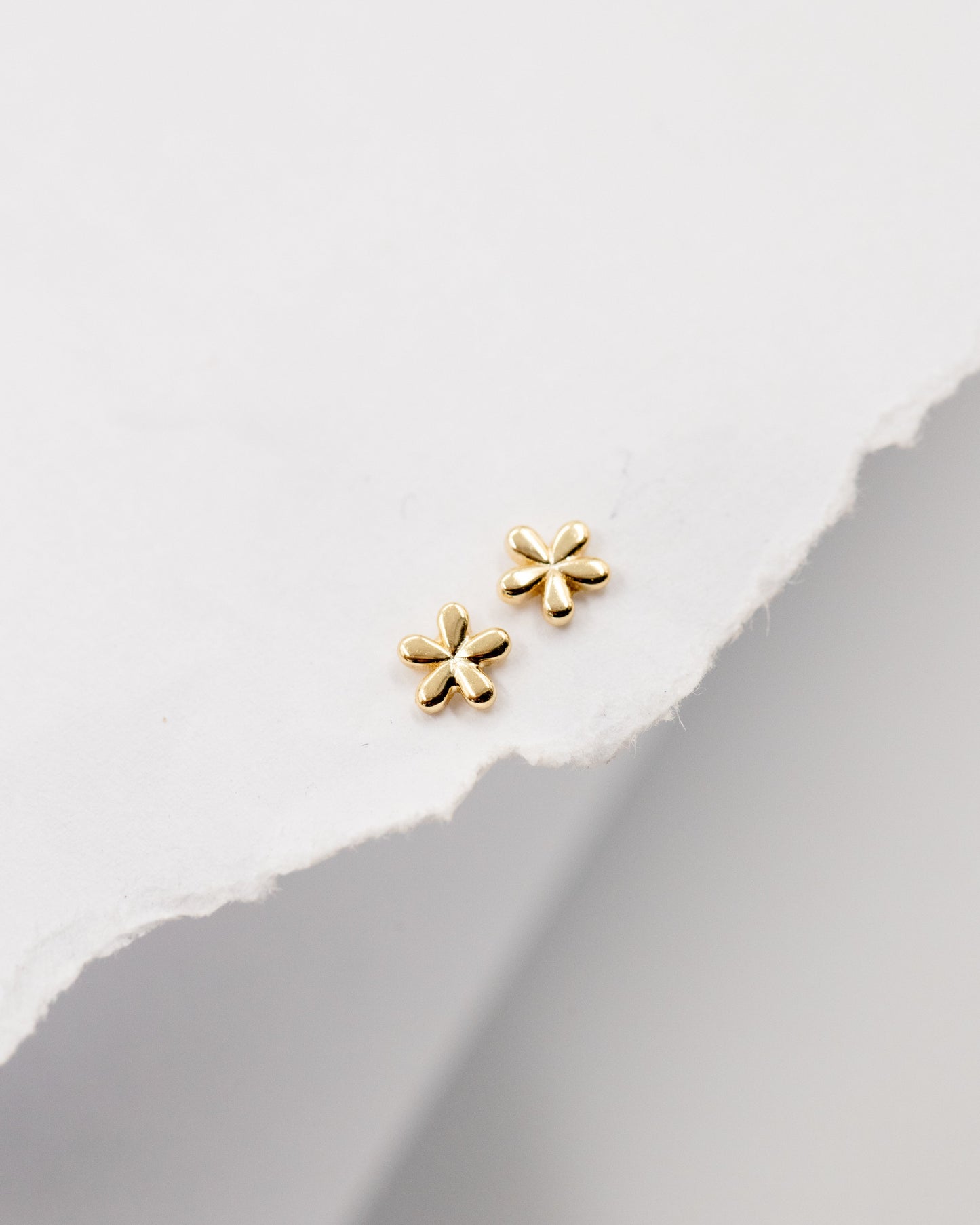 Teeny tiny flower stud earrings gold