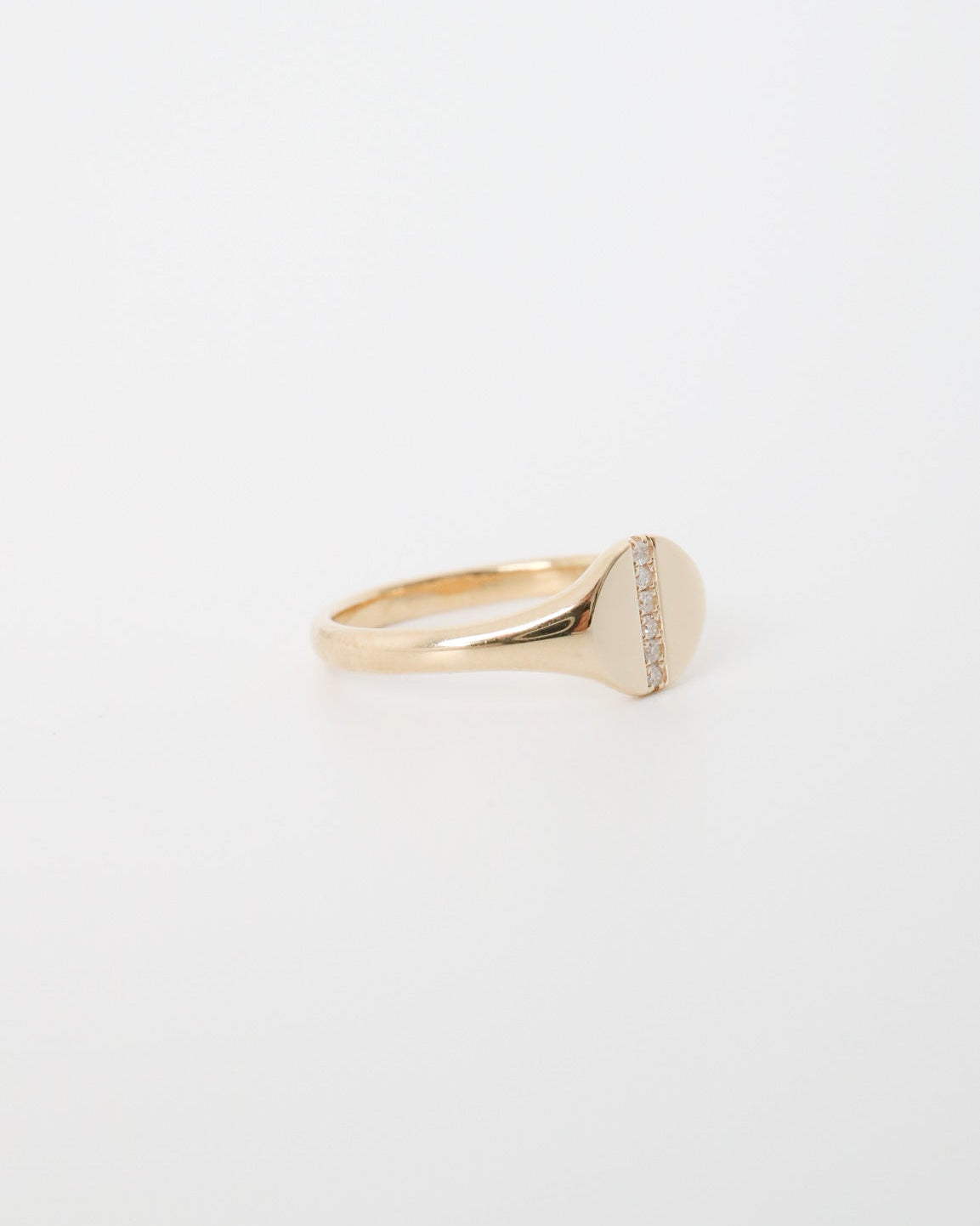 Gold ring with a diamond on a white background