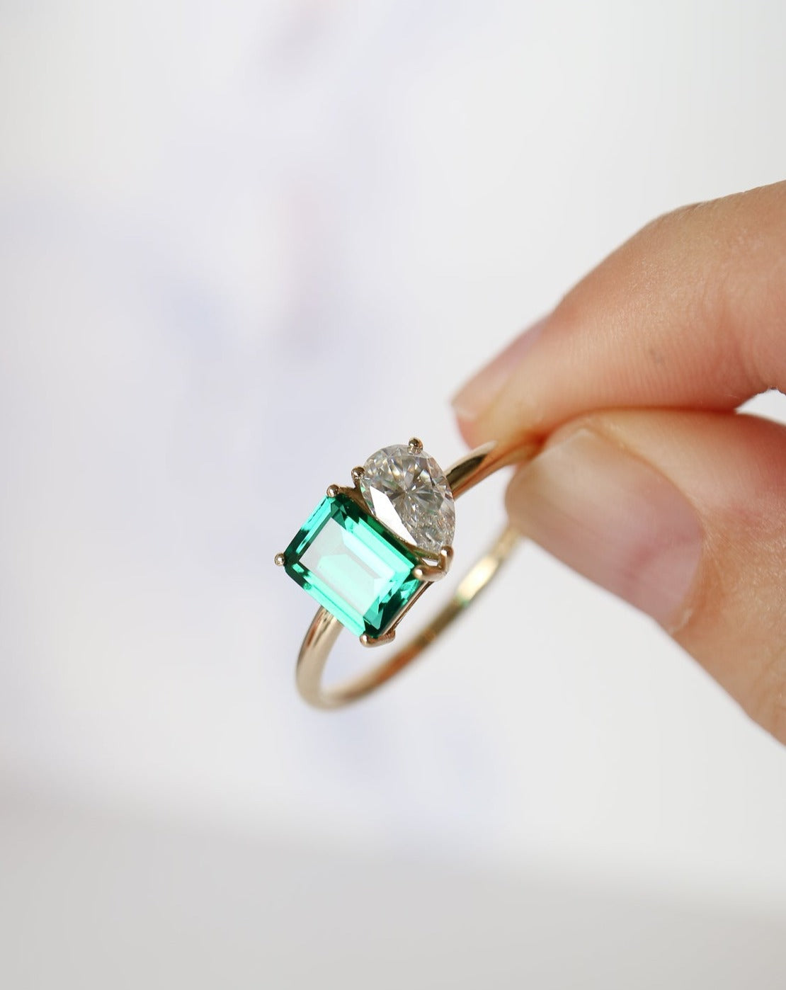 9kt gold Venus Ring with pear moissanite and emerald baguette from Theia Jewellery engagement rings