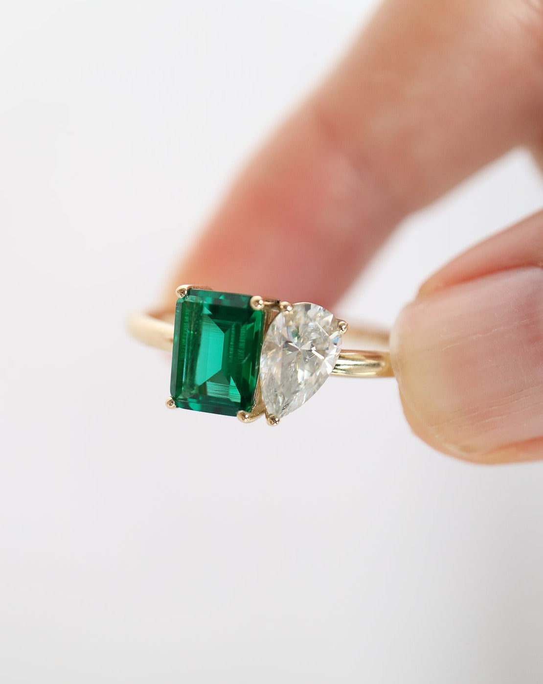 9kt gold Venus Ring with pear moissanite and emerald baguette