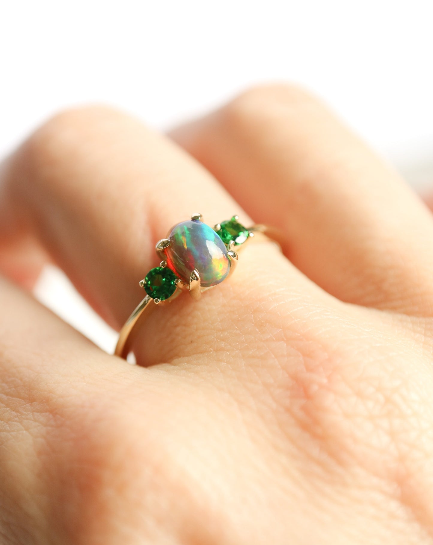 9ct gold ring with Ethiopian opal and tsavorite