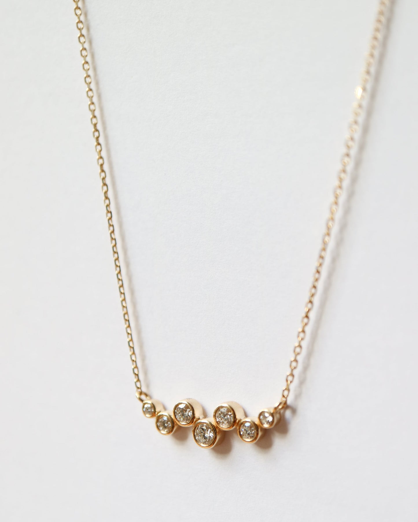 9ct gold necklace with seven round diamonds