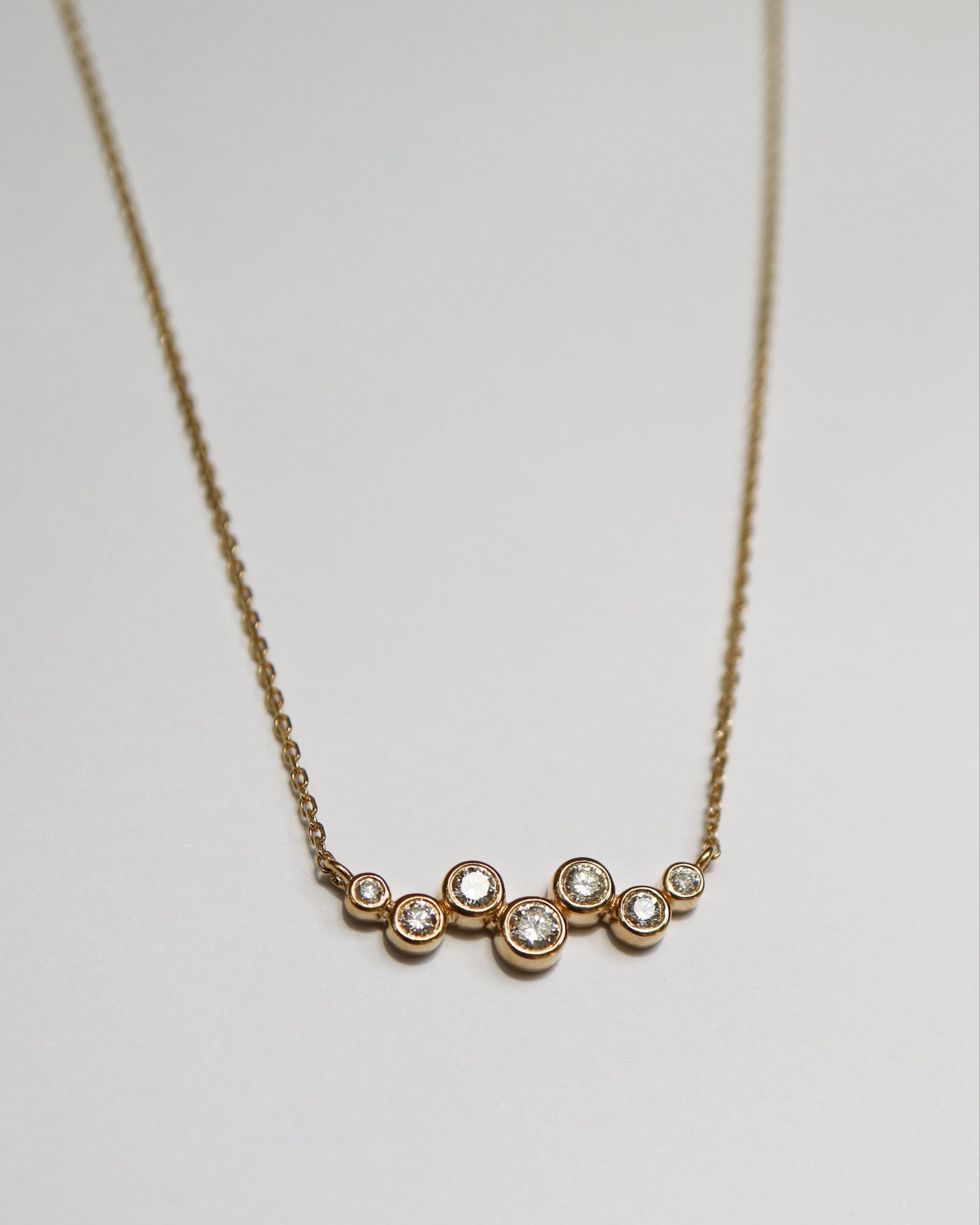 9ct gold necklace with seven round diamonds