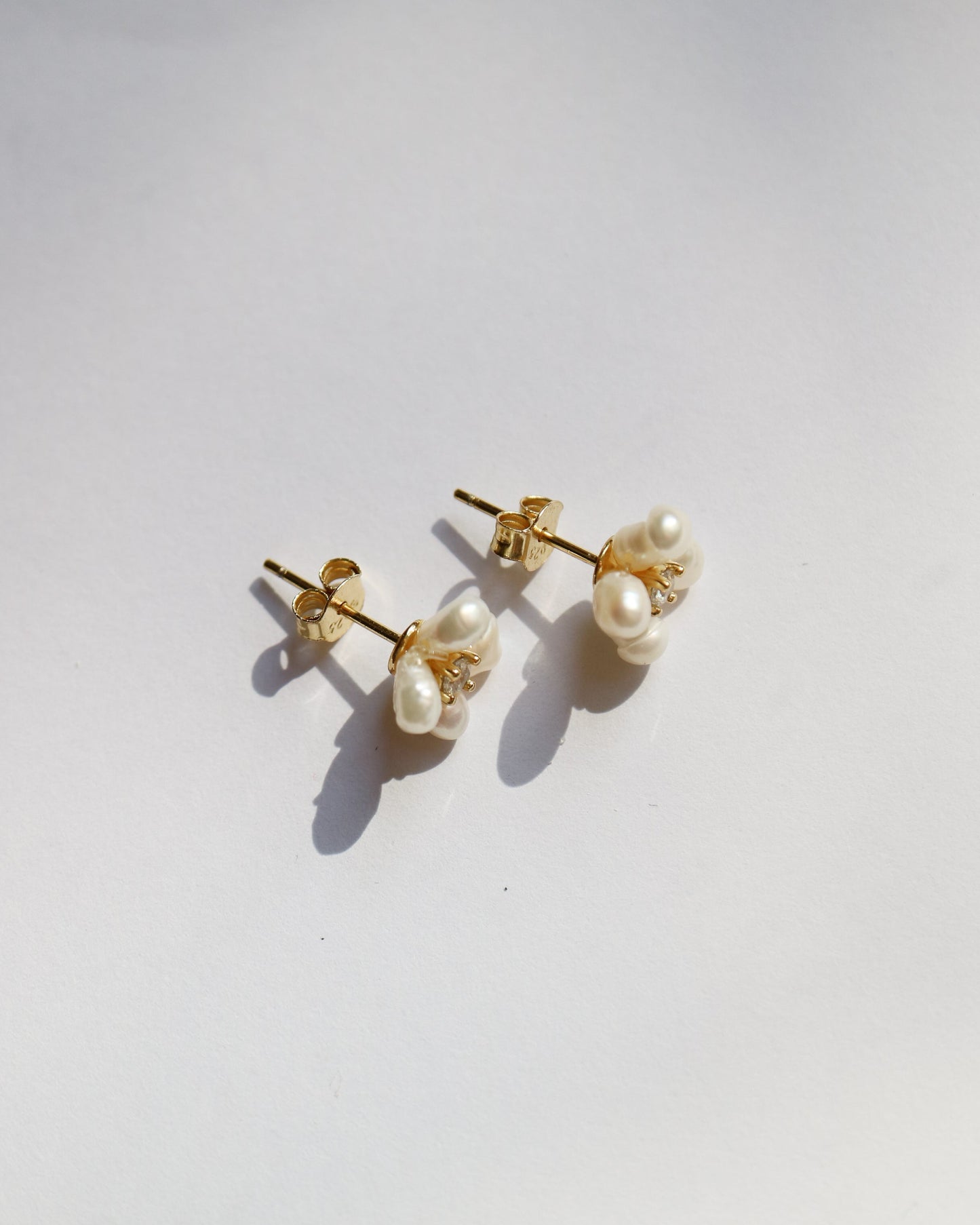 Pair of pearl earrings on a white background