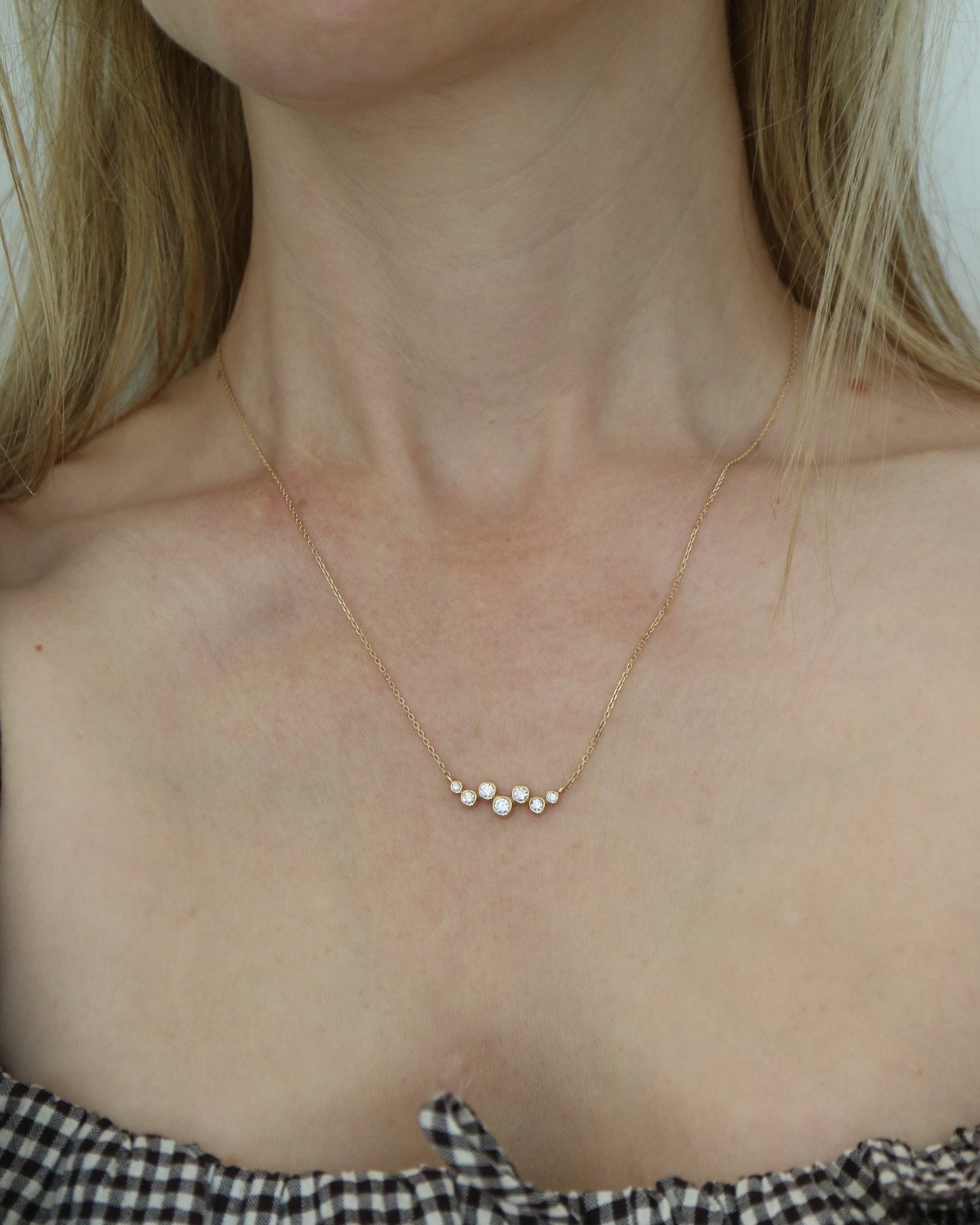 9ct gold necklace with seven round diamonds