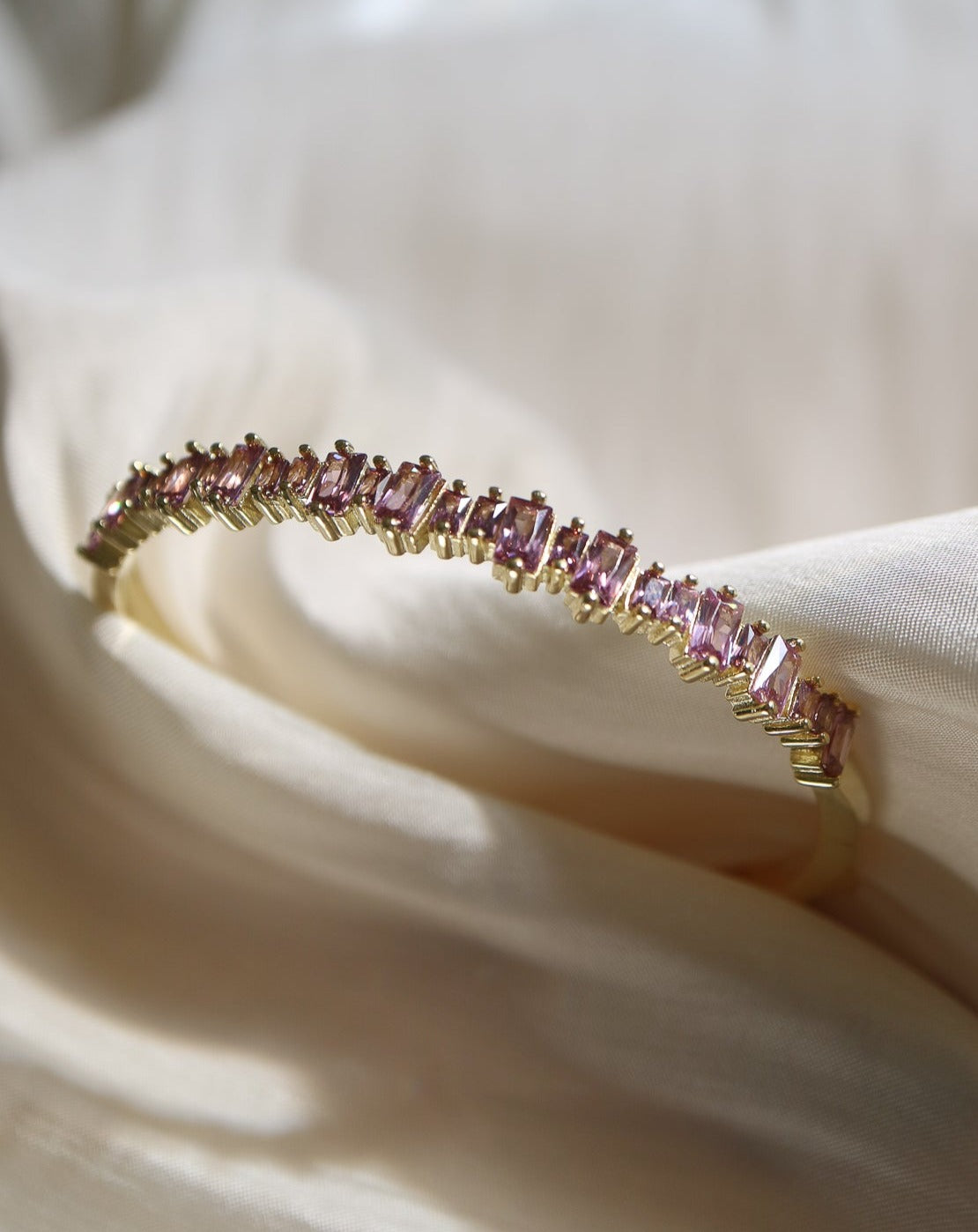 Gold bangle set with pink rose quartz, the Sugar Bangle from Collective & Co. jewellery is the statement bangle of the season