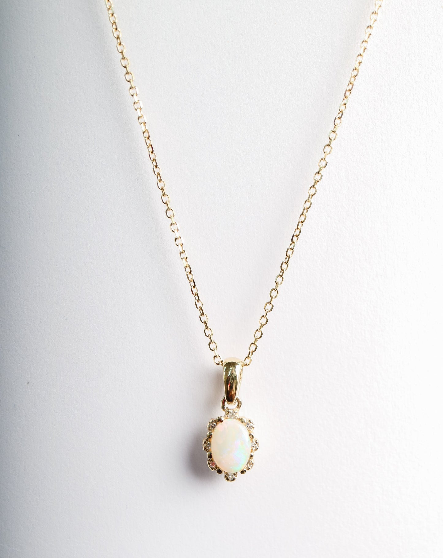 Opal and Diamond pendant in 9ct yellow gold