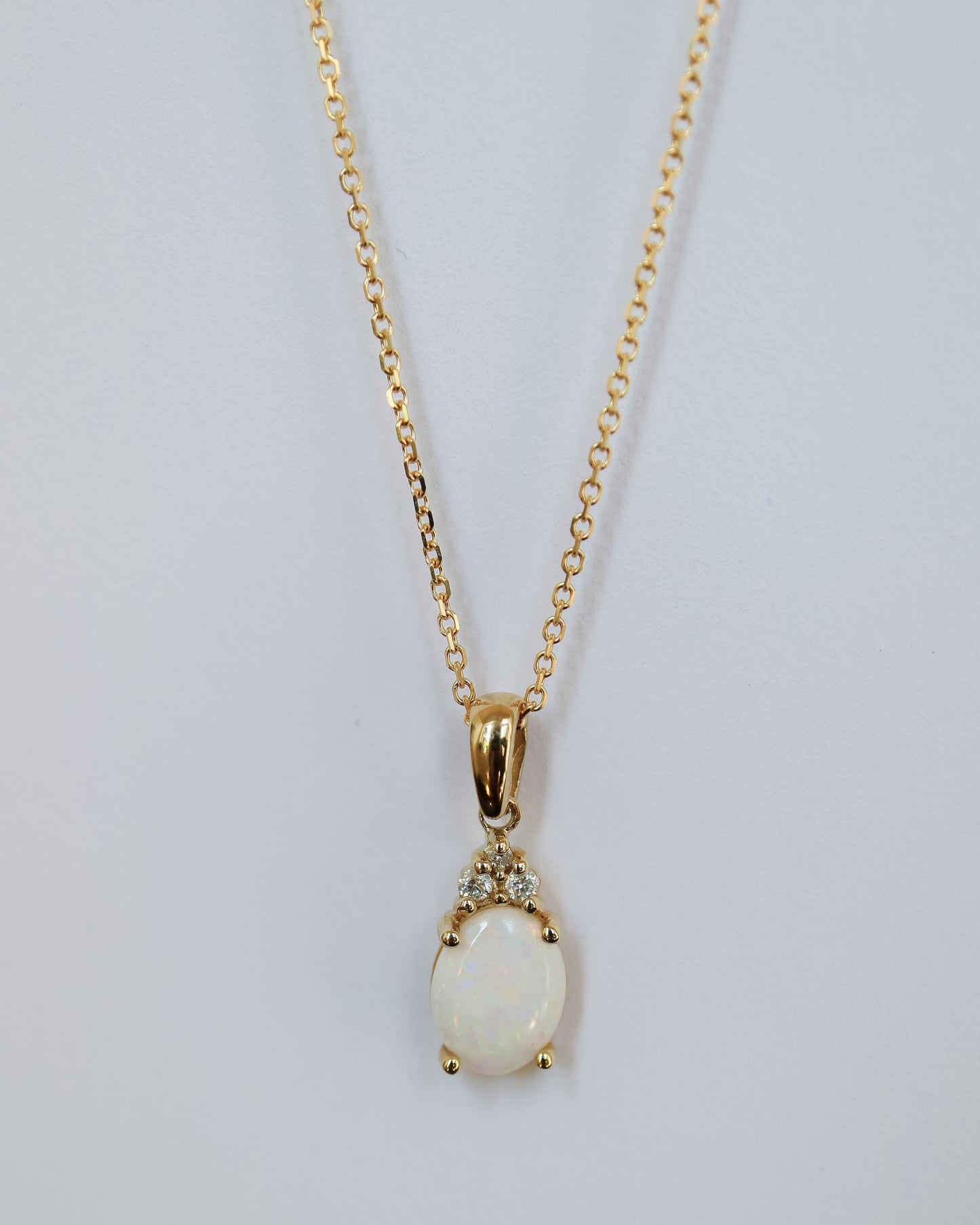 Opal and Diamond pendant in 9ct yellow gold