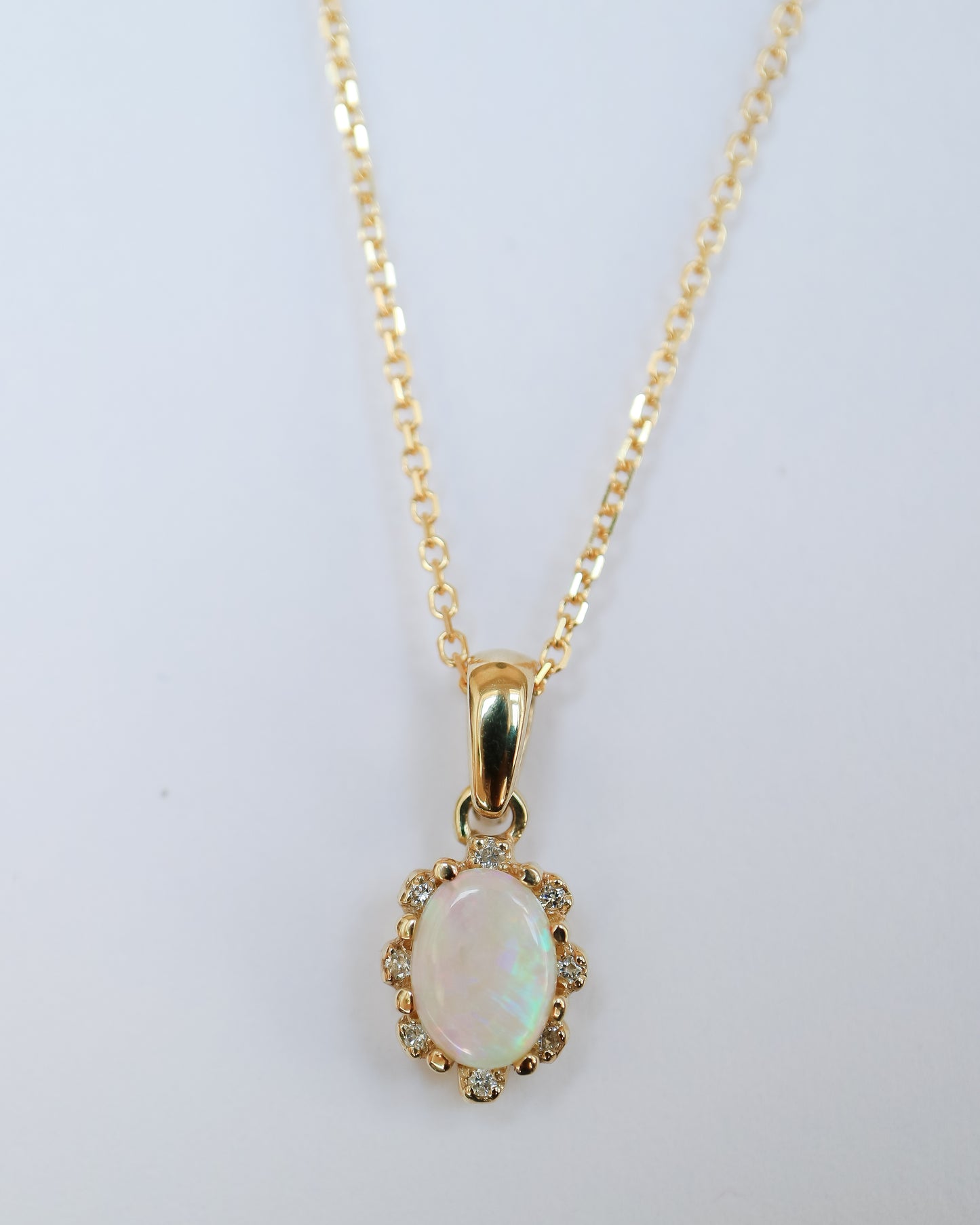 Opal and Diamond pendant in 9ct yellow gold
