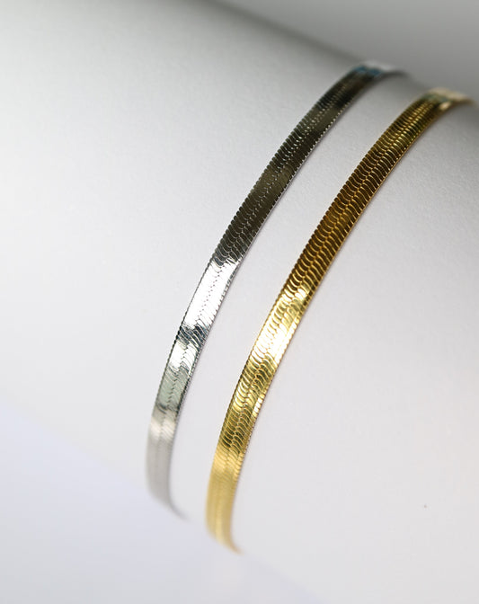 Herringbone bracelets in silver and gold