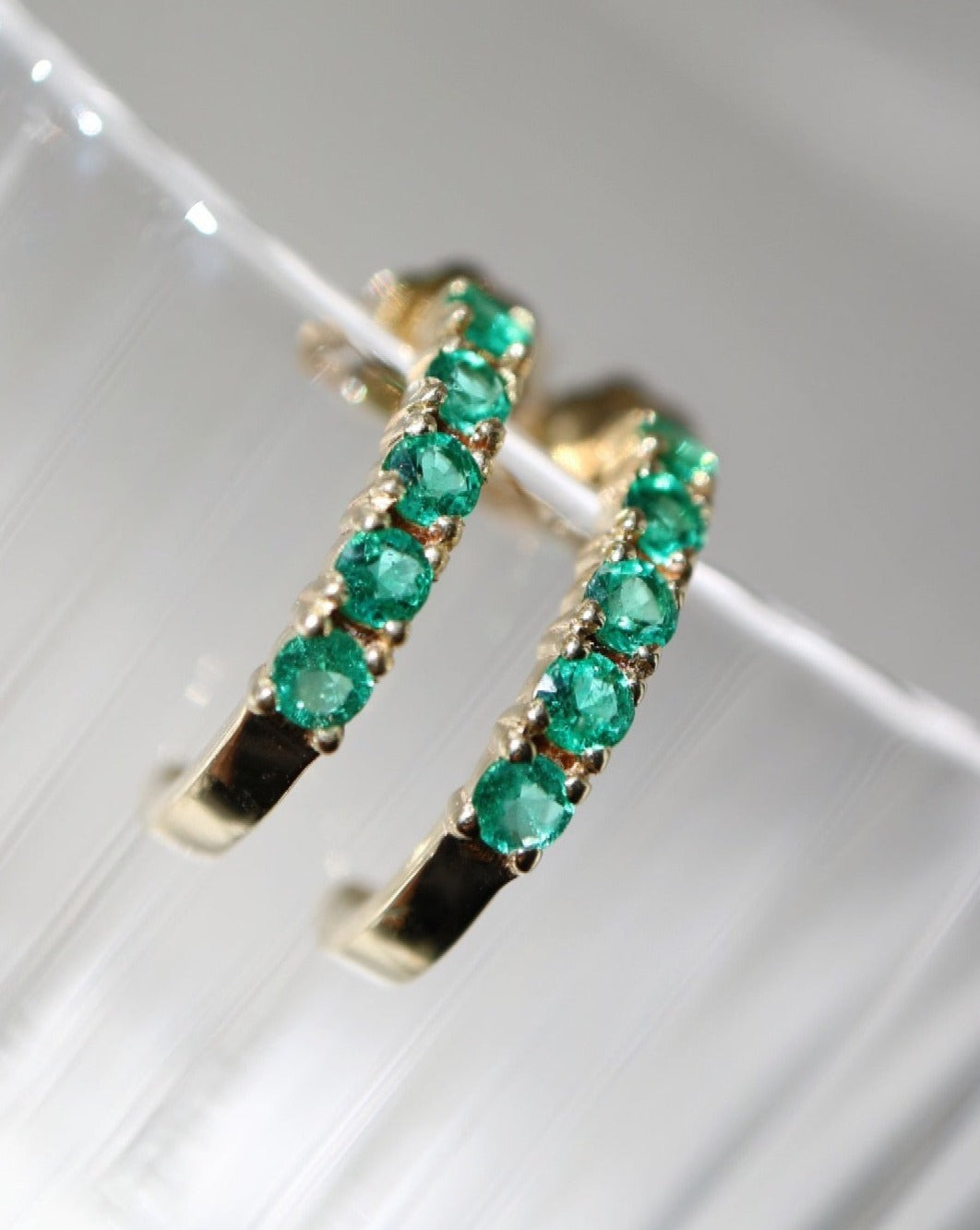 9ct emerald half eternity hoops