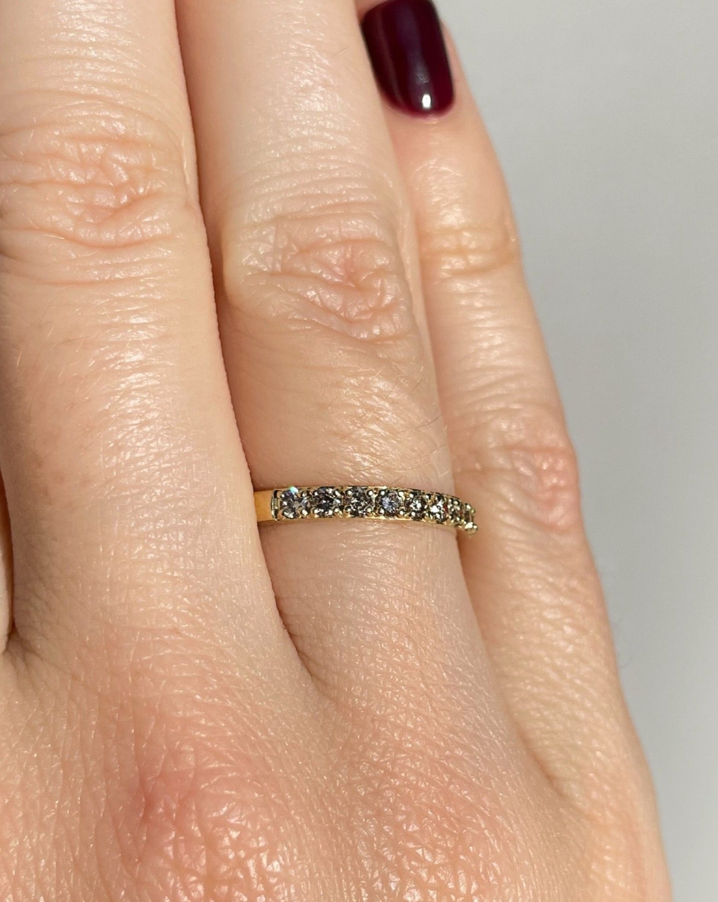 Collective & Co. 9ct gold and diamonds half eternity ring on ring finger