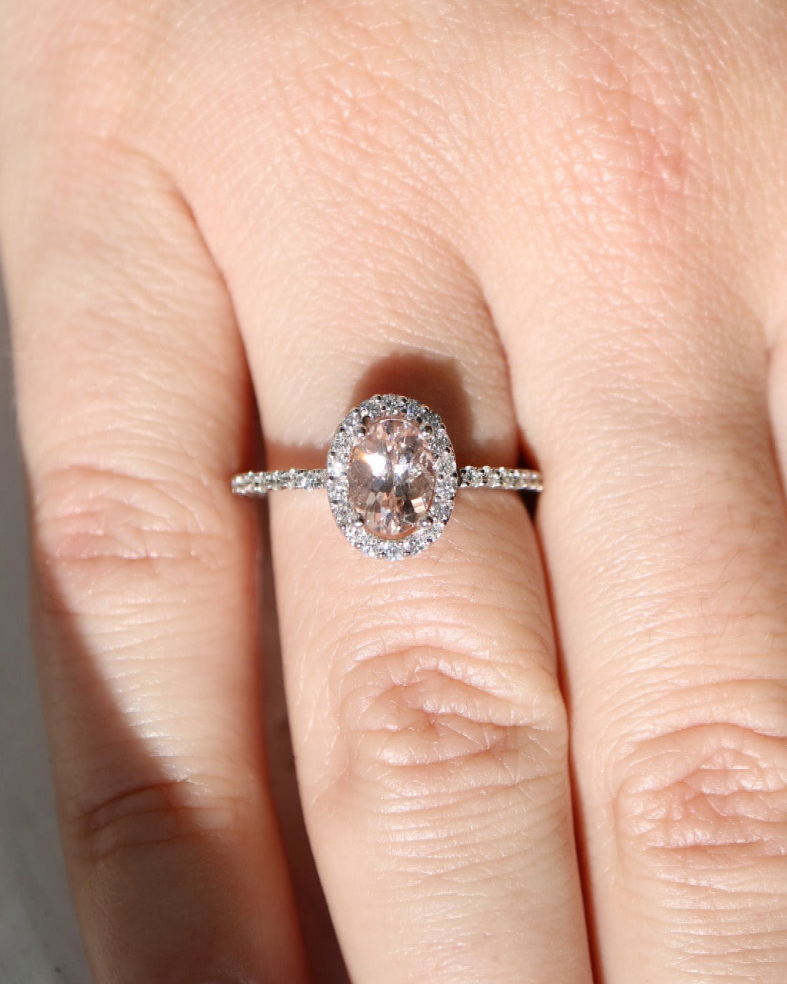 9ct white gold, morganite and diamond halo engagement ring
