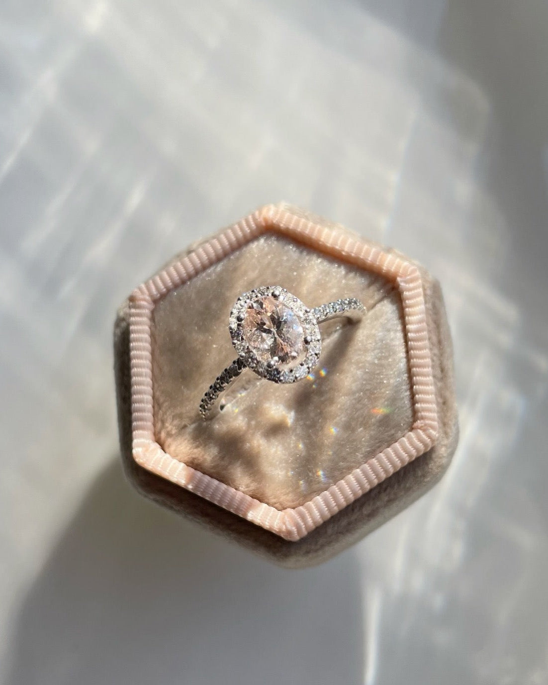 9ct white gold, morganite and diamond halo engagement ring