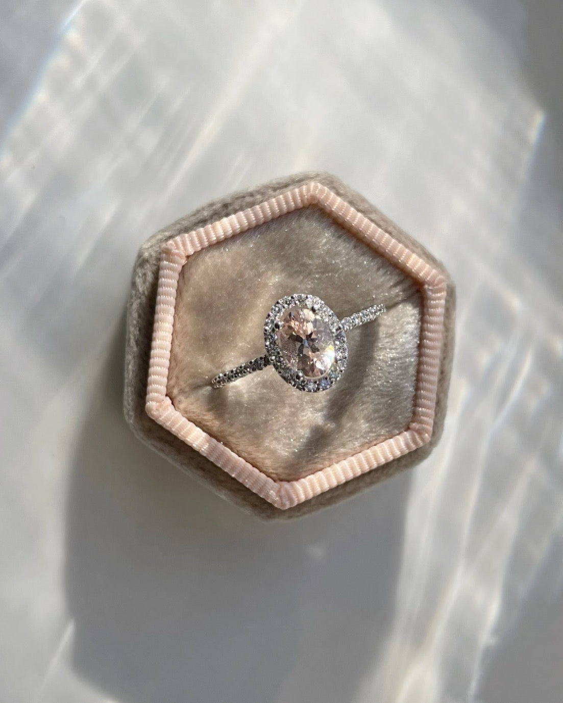 9ct white gold, morganite and diamond halo engagement ring