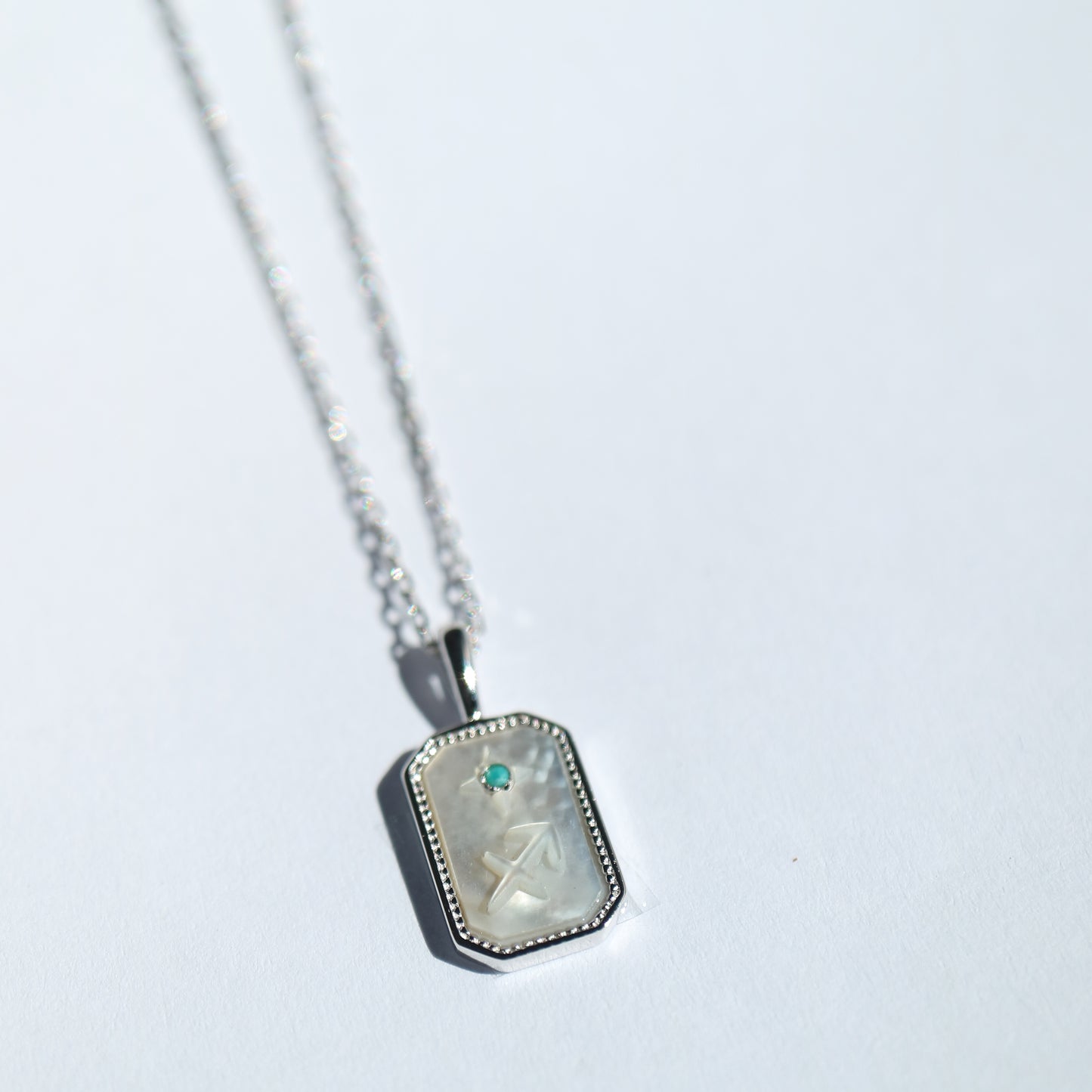 Star Sign Pendant in silver with Mother of Pearl
