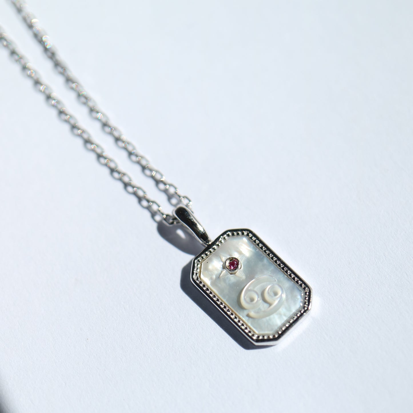 Star Sign Pendant in silver with Mother of Pearl