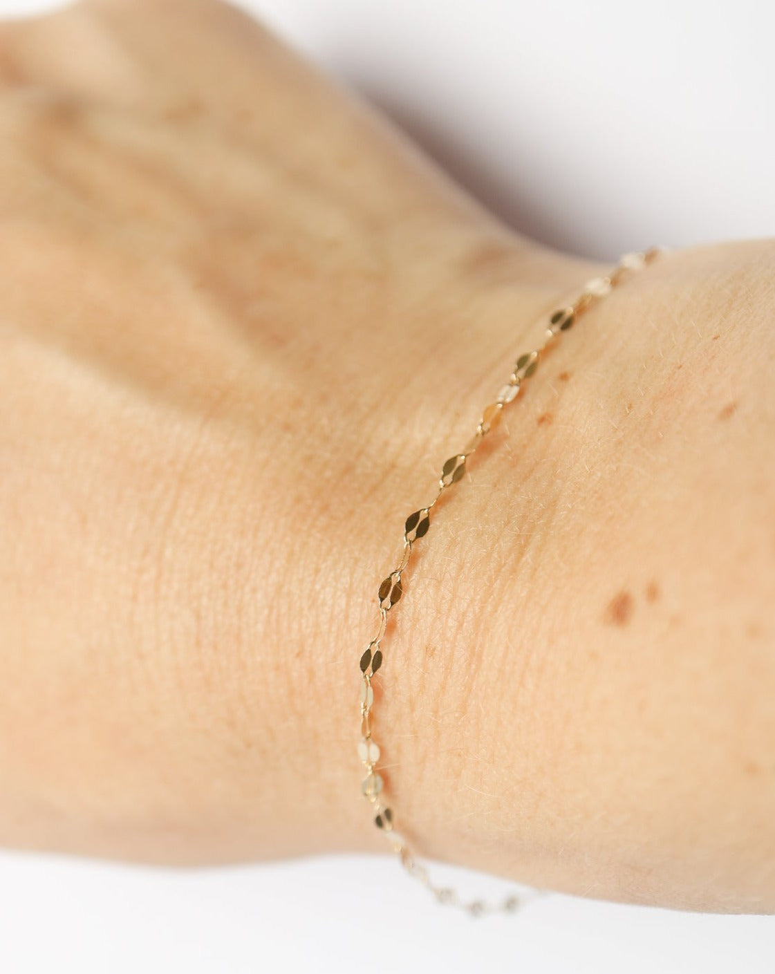 14kt gold Shimmer Bracelet on female wrist