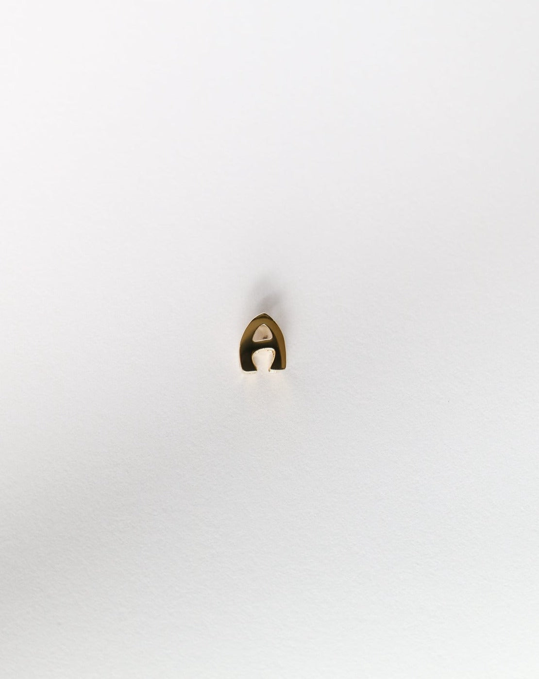A Letter charm initial in 14ct gold