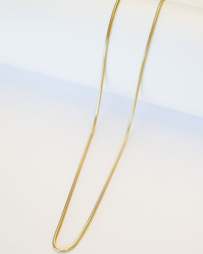 9ct gold Skinny Real Snake Chain over white background
