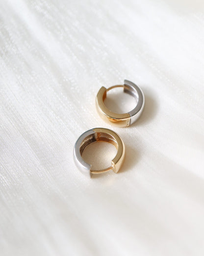 Close-up of 9kt solid gold Two Tone Hoops showcasing their sculptural shape and contrasting gold and silver finishes, perfect for modern everyday styling.