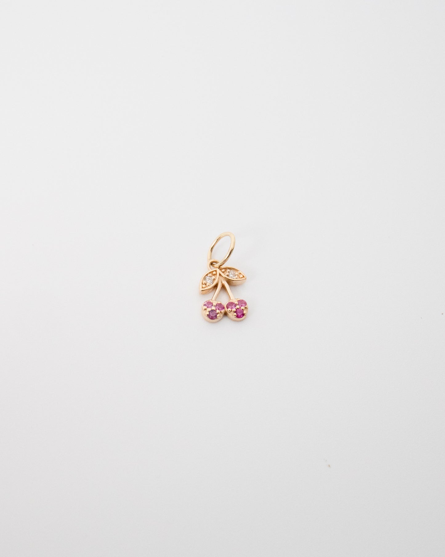 Gold and ruby cherry charm