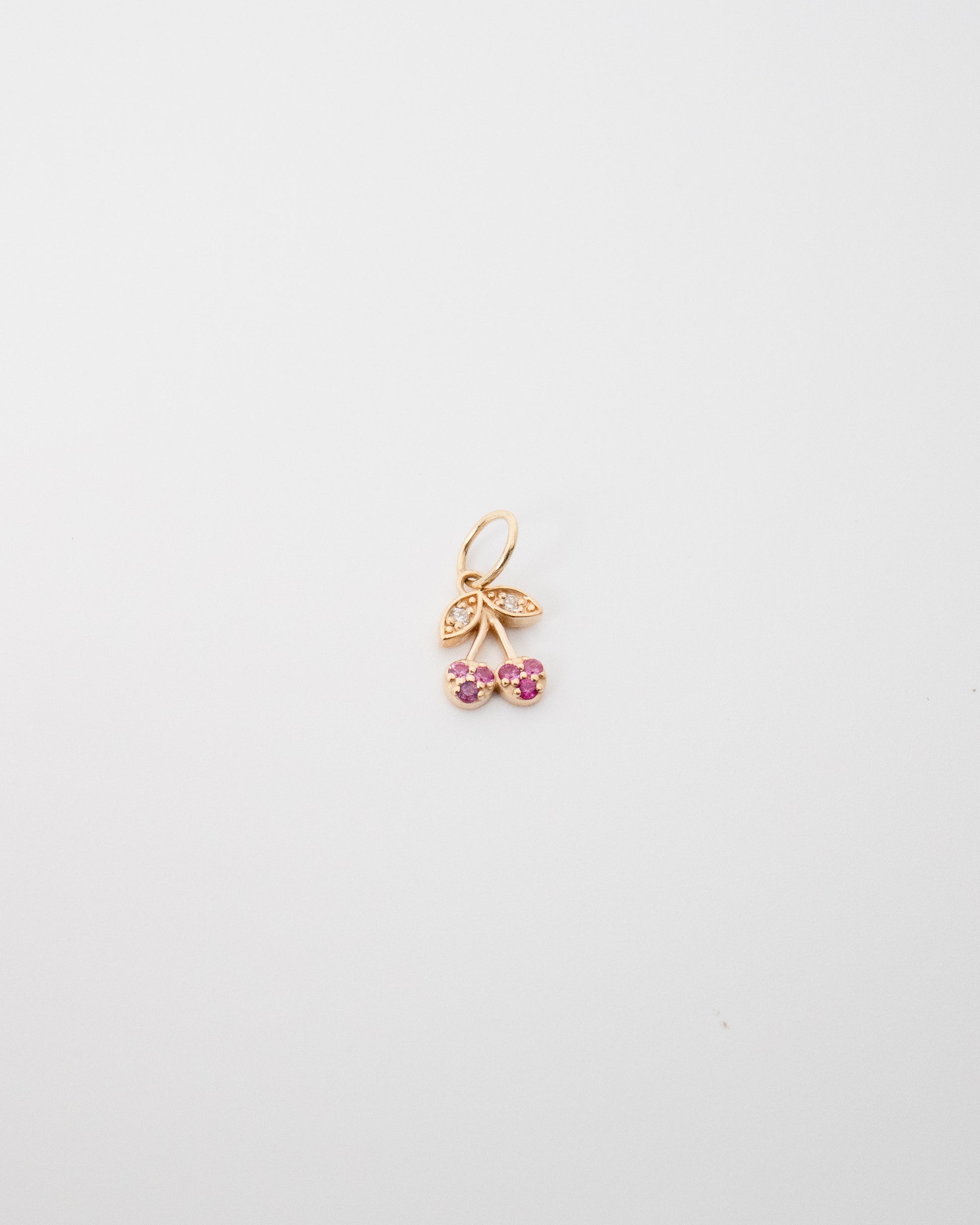 Gold and ruby cherry charm