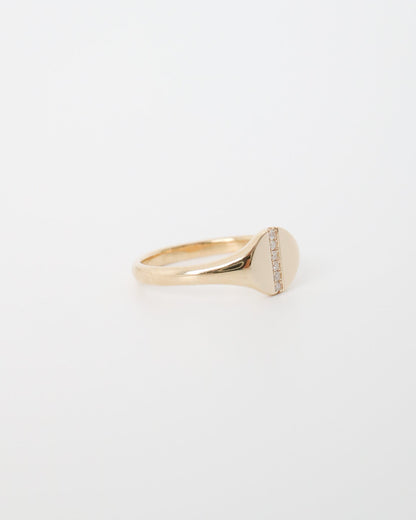 Gold ring with a diamond on a white background
