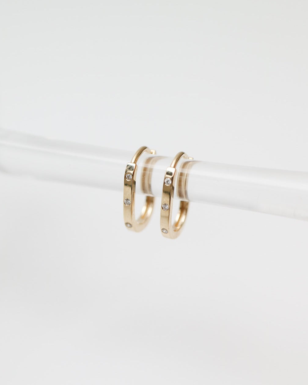 Gold hoop earrings on a white background