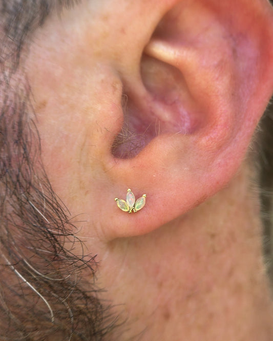 9kt gold and opal marquise stud earring in male ear