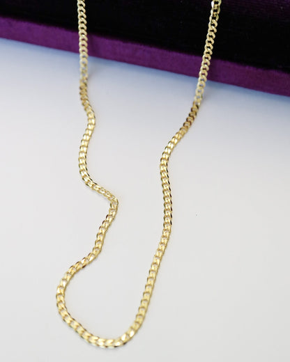 9kt solid gold Flat Curb Chain necklace featuring polished, flattened interlocking links, photographed on a white background.