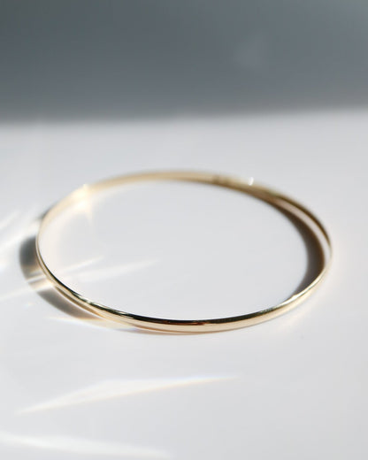 Gold ring on a white surface