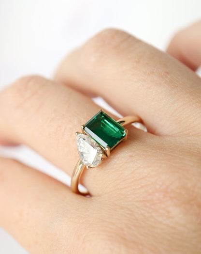 9kt gold Venus Ring with pear moissanite and emerald baguette from Theia Jewellery engagement rings