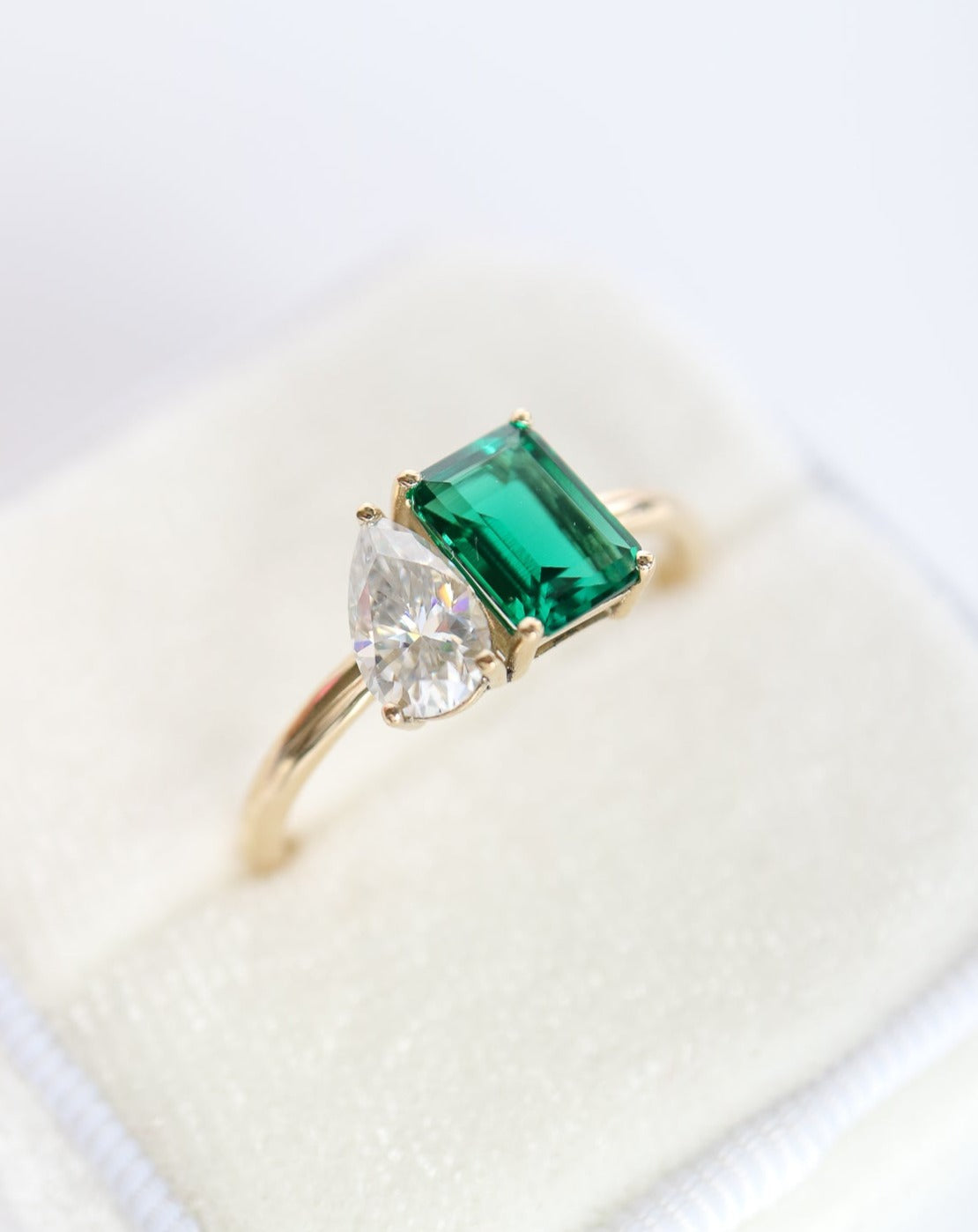 9kt gold Venus Ring with pear moissanite and emerald baguette