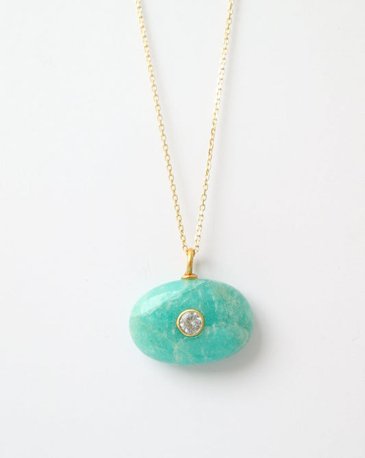 Amazonite Azure Charm featuring a polished oval amazonite gemstone with natural turquoise veining, a bezel-set cubic zirconia, and a gold plated sterling silver bail on a white background.
