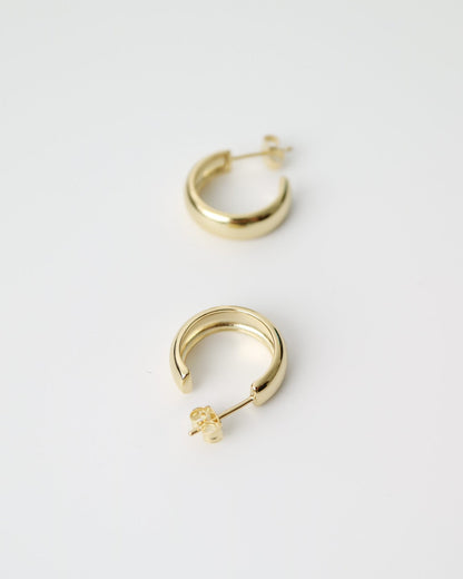 Aurelia Hoops in 14kt gold plated sterling silver featuring a polished rounded hoop design with butterfly back fastenings.