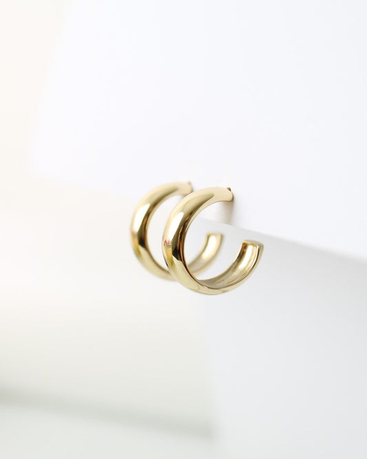 Aurelia Hoops in 14kt gold plated sterling silver featuring a polished rounded hoop design with butterfly back fastenings.