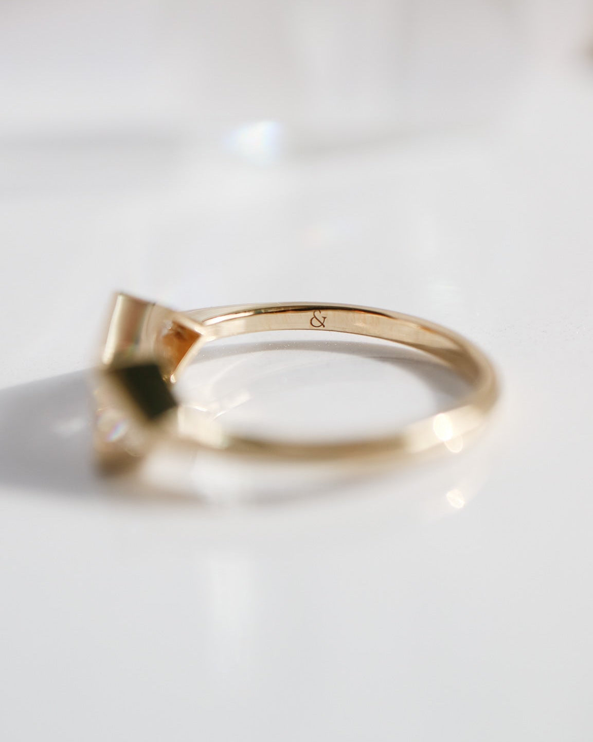 Gold ring on a white background