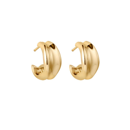 Gold hoop earrings on a white background