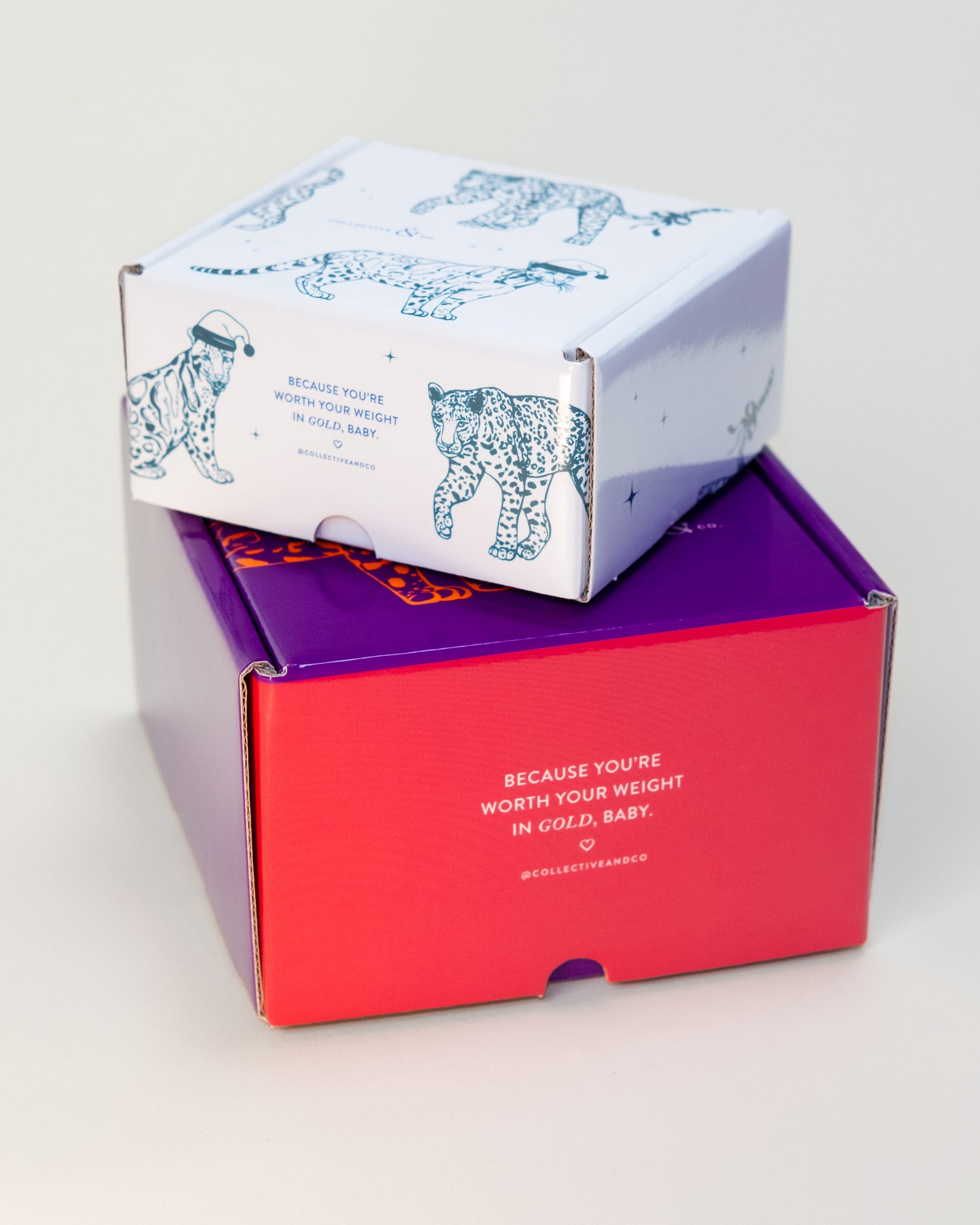 Two stacked boxes, one purple and one red, on a light gray background