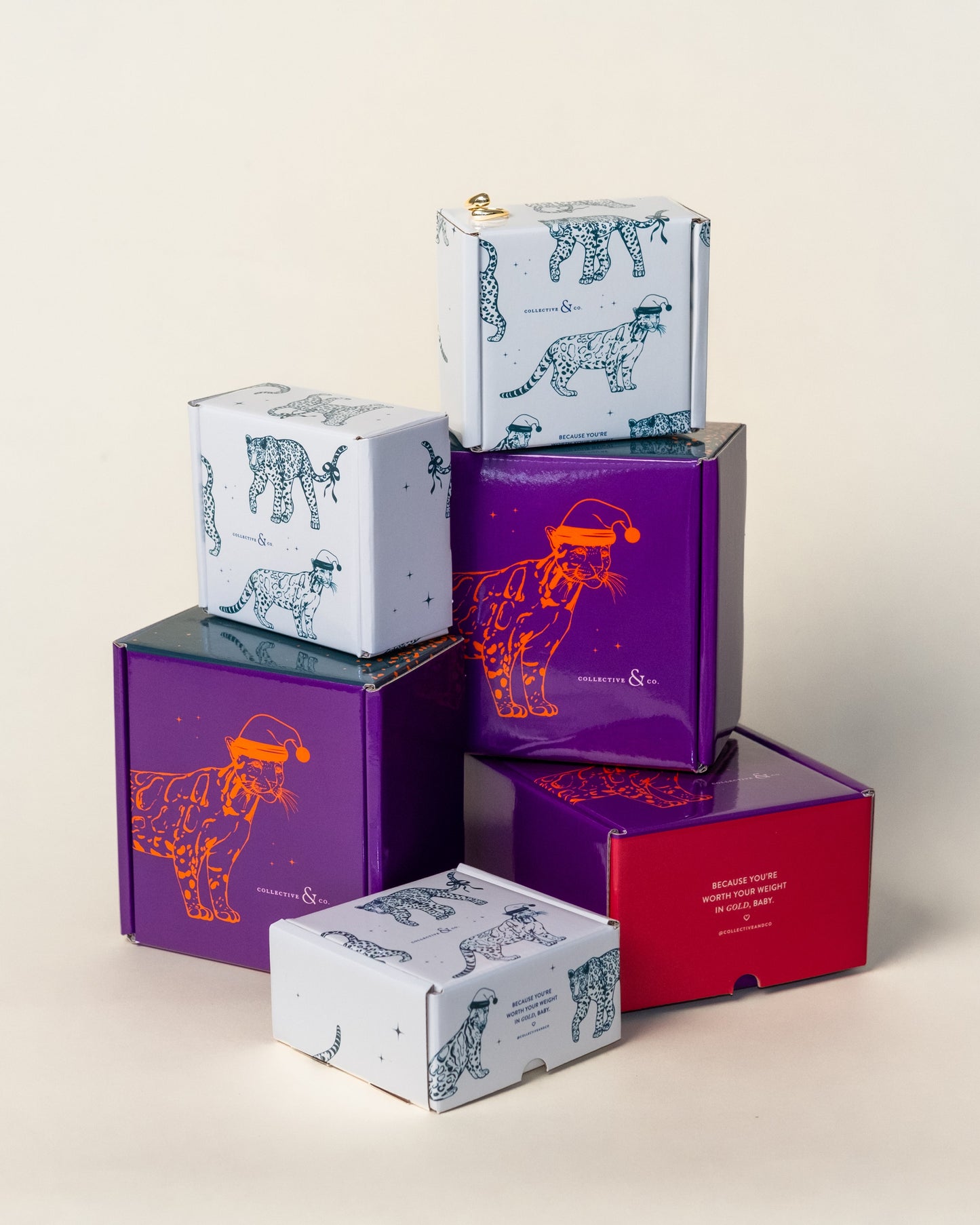 Stack of colorful boxes with animal illustrations on a light background