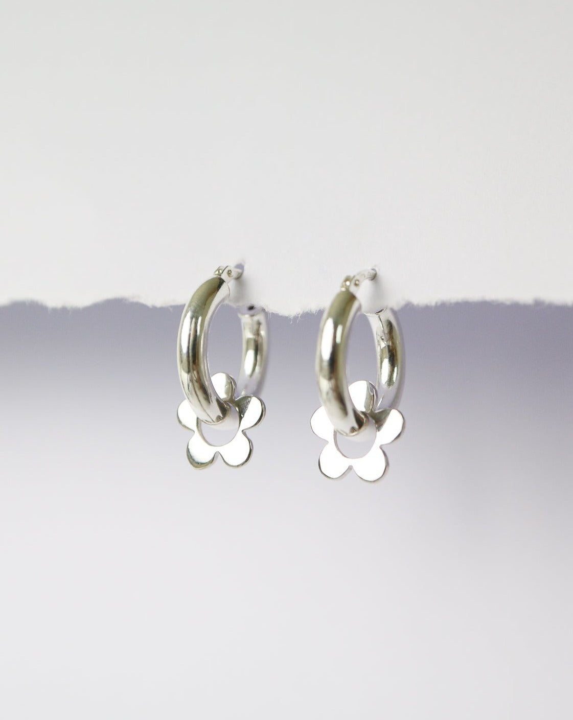 Silver hoops earrings with silver daisy flower charms