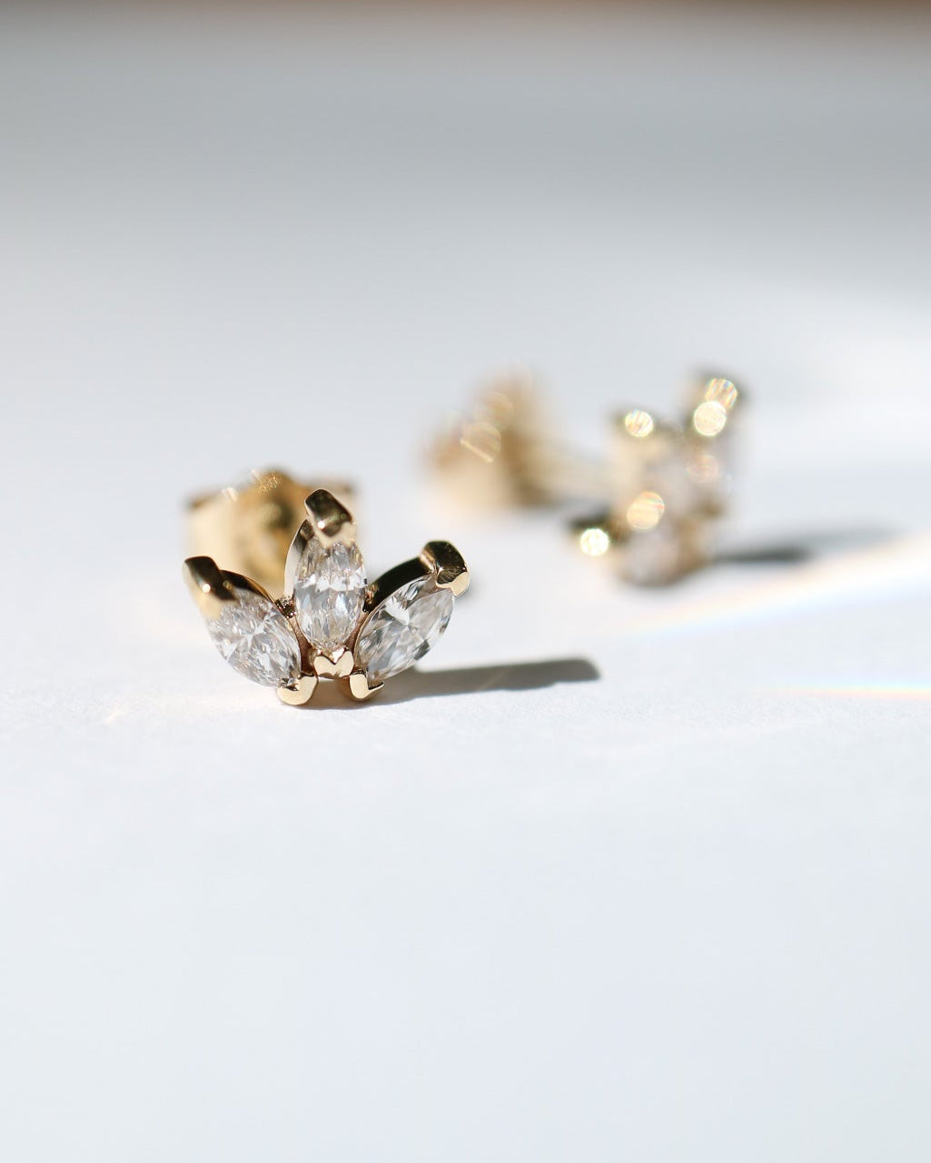 Delicate 9kt gold lotus studs with diamonds