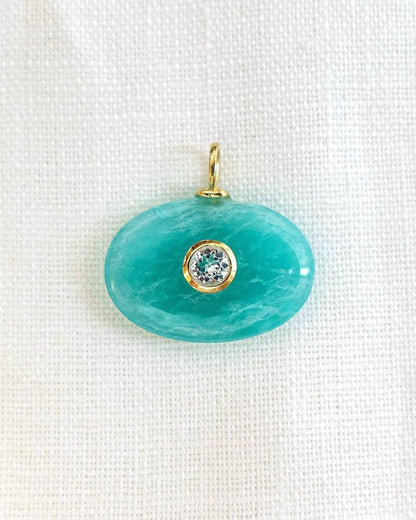 Discover the Amazonite Azure Charm, featuring a polished natural amazonite gemstone accented with a sparkling cubic zirconia in gold plated sterling silver. A meaningful pendant inspired by balance, harmony, and everyday elegance.