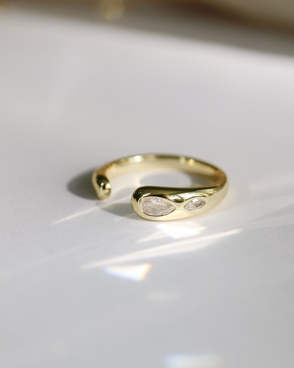 Elio Drop Ring in S925 14kt gold plated silver with pear-cut and marquise-cut CZ