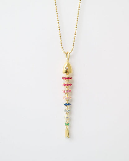Gold necklace with colorful beads on a white background