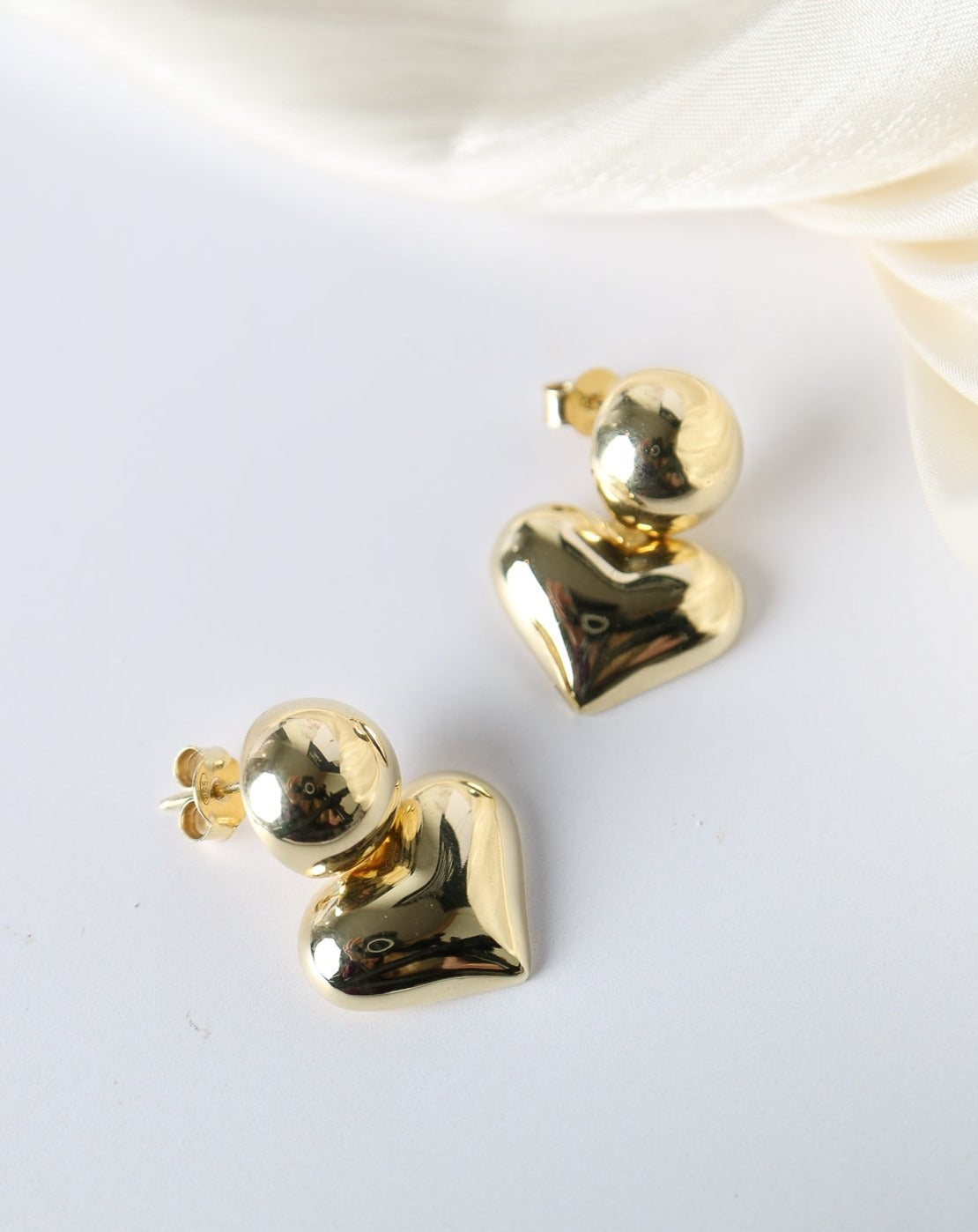 Chunky gold heart earrings from Collective & Co. jewellery store