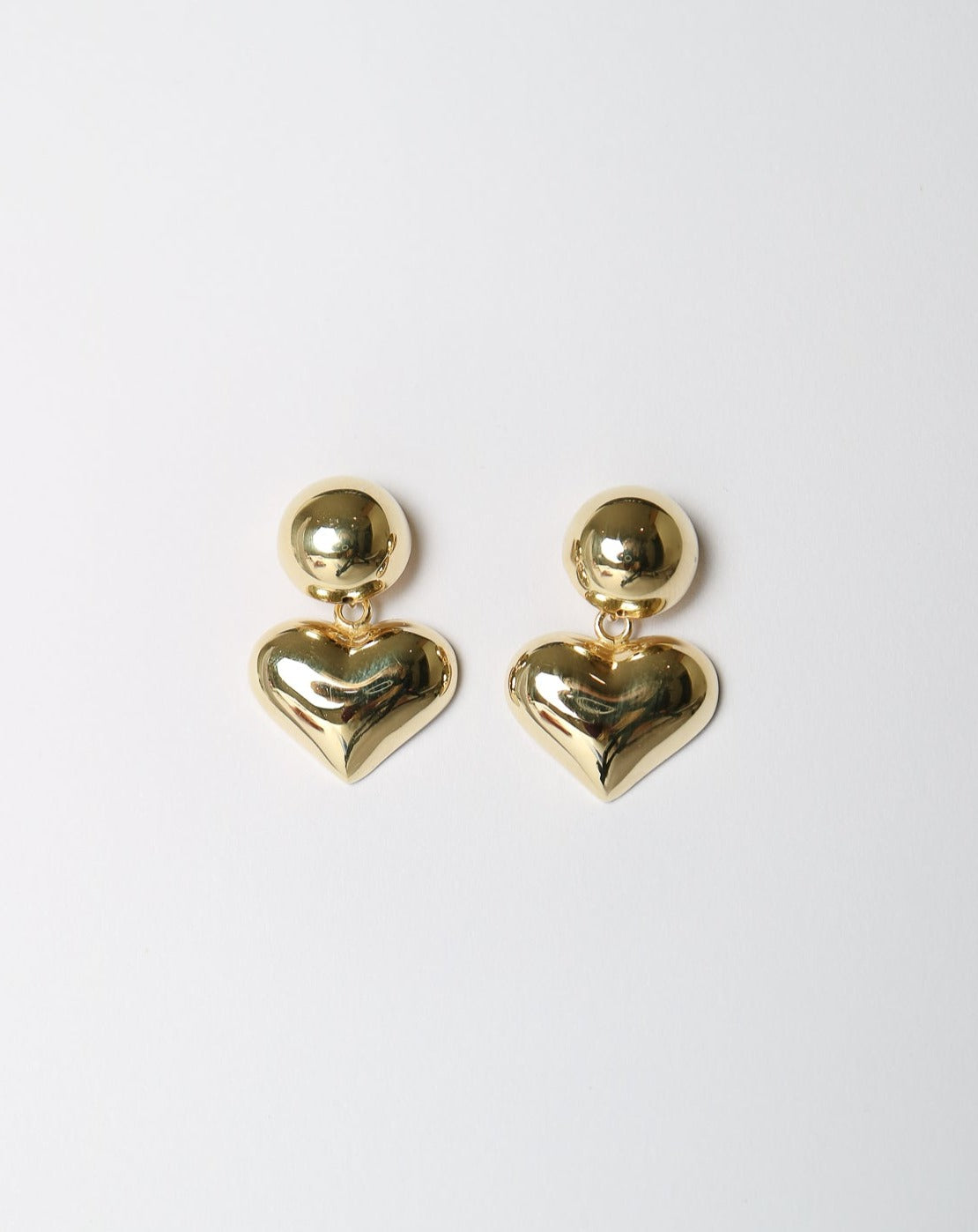 Chunky gold heart earrings from Collective & Co. jewellery store